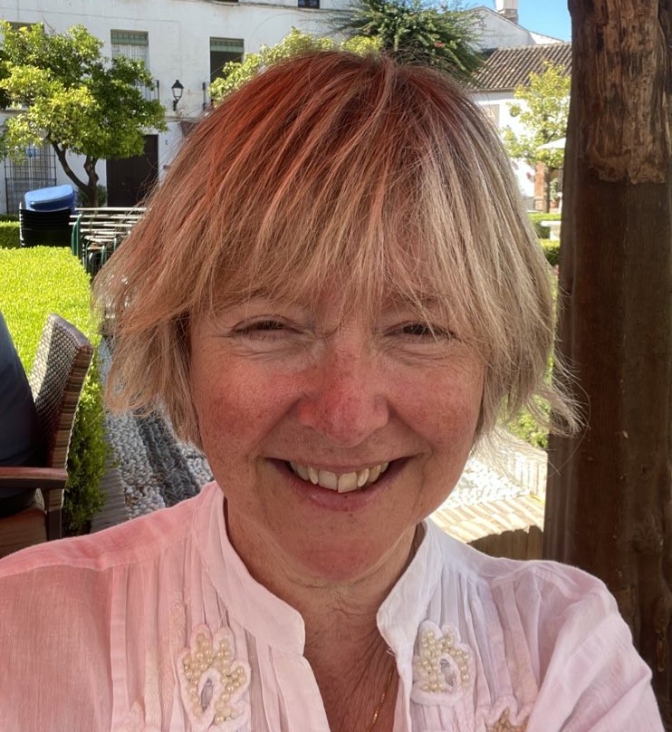 Mary-Kate O'Regan, in a sunny outdoors location wearing a white blouse